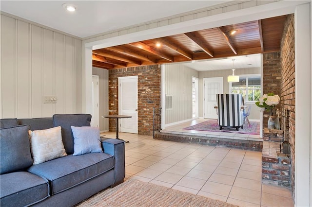 tiled living room with wooden ceiling and brick wall