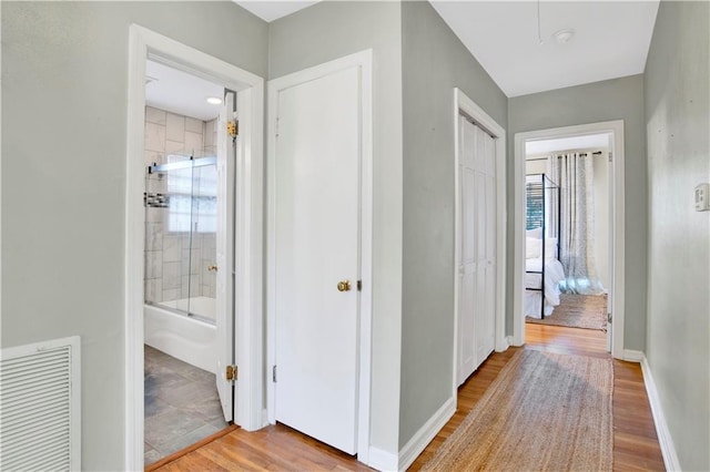 hall with light wood-type flooring