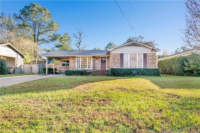 single story home with a carport and a front lawn