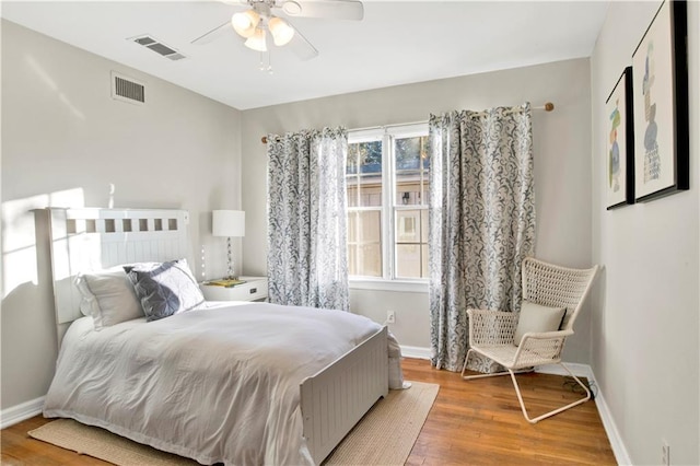 bedroom featuring wood-type flooring and ceiling fan