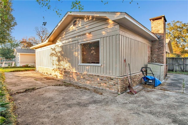 view of side of home with a patio area