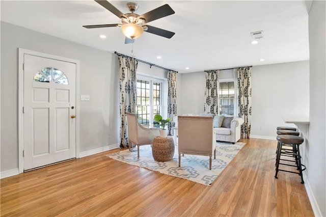 entrance foyer featuring ceiling fan and light hardwood / wood-style flooring