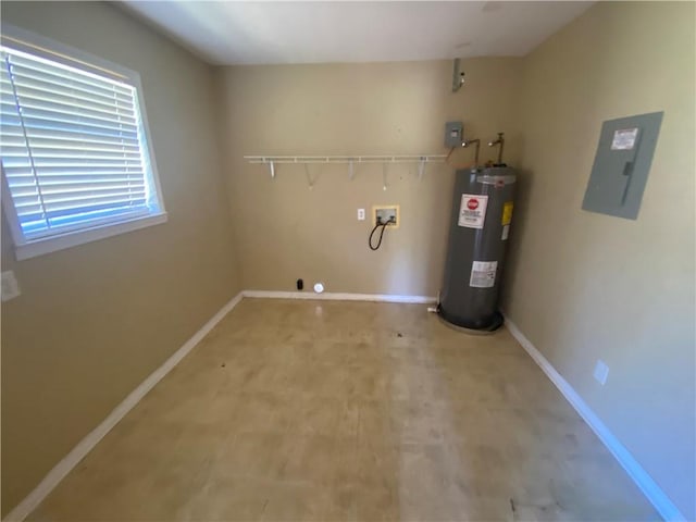 laundry area featuring baseboards, water heater, laundry area, hookup for a washing machine, and electric panel