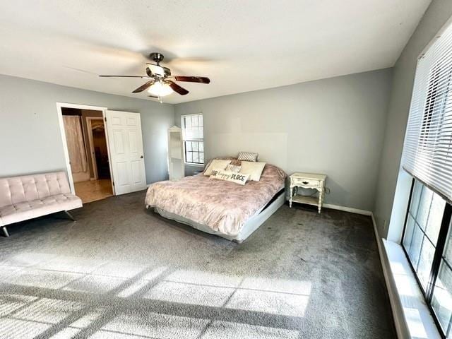 bedroom with a ceiling fan and carpet floors