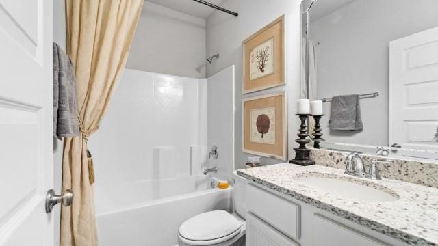 bathroom with vanity, toilet, and shower / bathtub combination with curtain