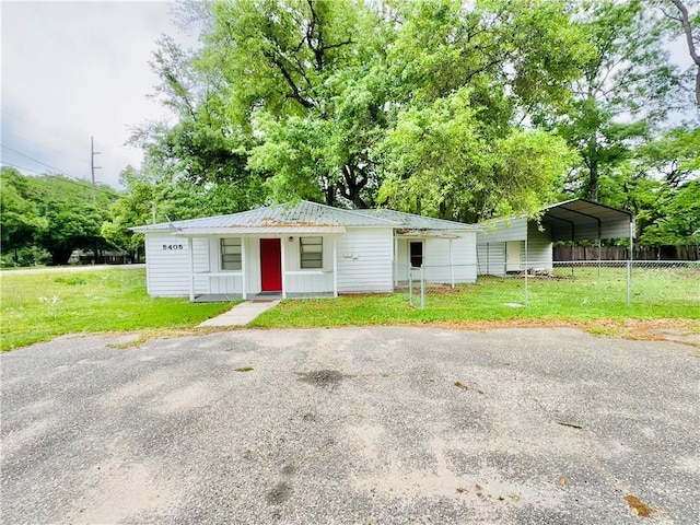 5405 Moffett Rd, Mobile, AL 36618 - view of front of home featuring driveway, a detached carport, metal roof, a front yard, and fence