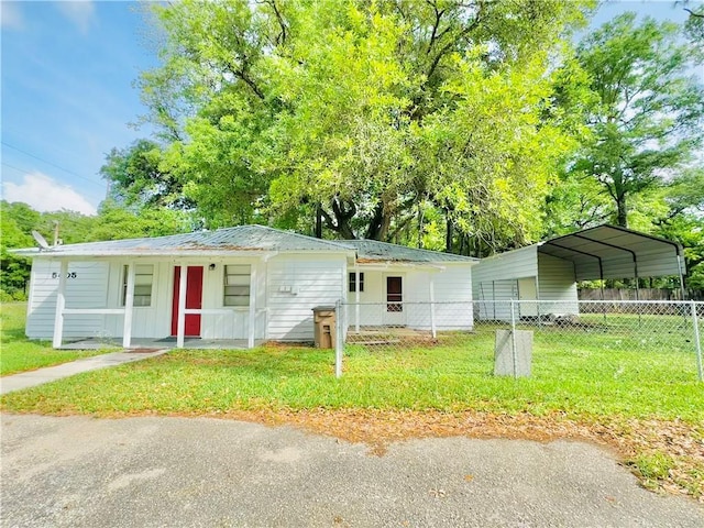 5405 Moffett Rd, Mobile, AL 36618 - ranch-style home featuring fence, a carport, and a front yard