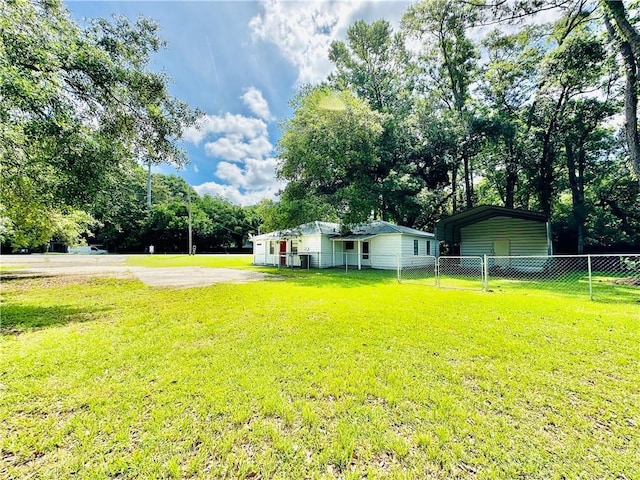 5405 Moffett Rd, Mobile, AL 36618 - view of yard with a carport and fence