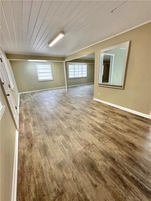 5405 Moffett Rd, Mobile, AL 36618 - unfurnished room featuring baseboards, wood finished floors, and wood ceiling