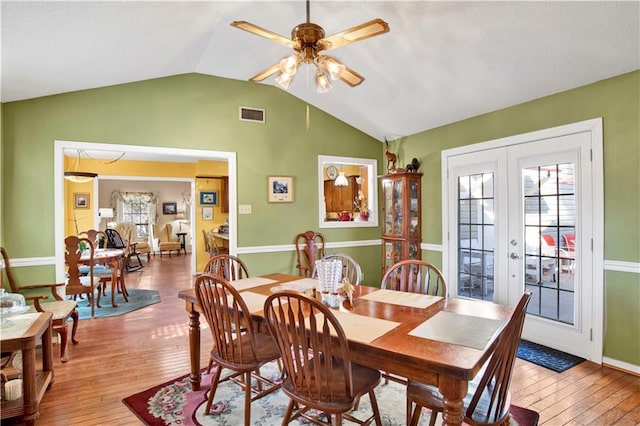 2805 Brookside Dr, Mobile, AL 36693 - dining room featuring french doors, vaulted ceiling, ceiling fan, and wood-type flooring