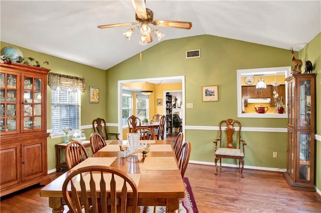 2805 Brookside Dr, Mobile, AL 36693 - dining room with wood-type flooring, vaulted ceiling, and ceiling fan