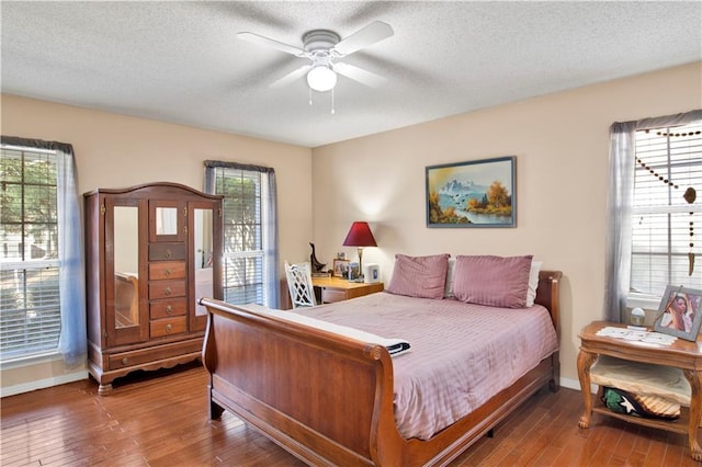 2805 Brookside Dr, Mobile, AL 36693 - bedroom featuring multiple windows, ceiling fan, a textured ceiling, and hardwood / wood-style flooring