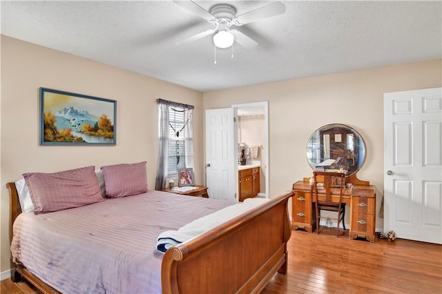 2805 Brookside Dr, Mobile, AL 36693 - bedroom featuring connected bathroom, ceiling fan, and light hardwood / wood-style floors