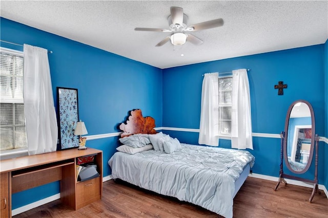 2805 Brookside Dr, Mobile, AL 36693 - bedroom with a textured ceiling, ceiling fan, and dark hardwood / wood-style floors