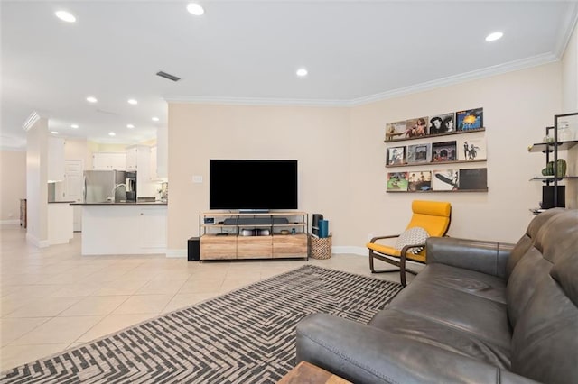 living room with crown molding and light tile patterned floors