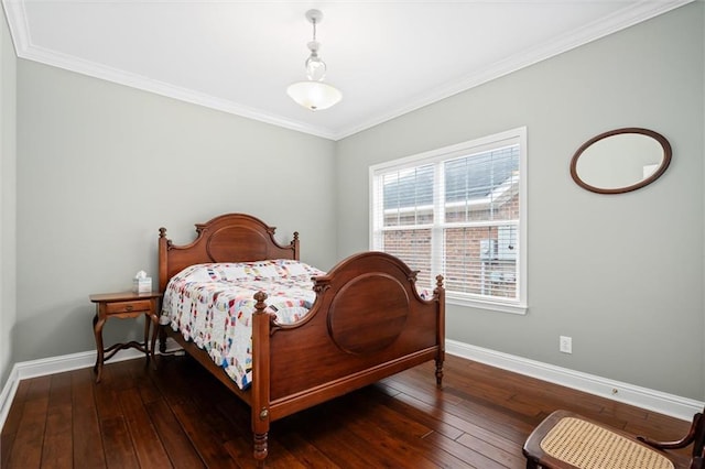 bedroom with ornamental molding and dark hardwood / wood-style flooring