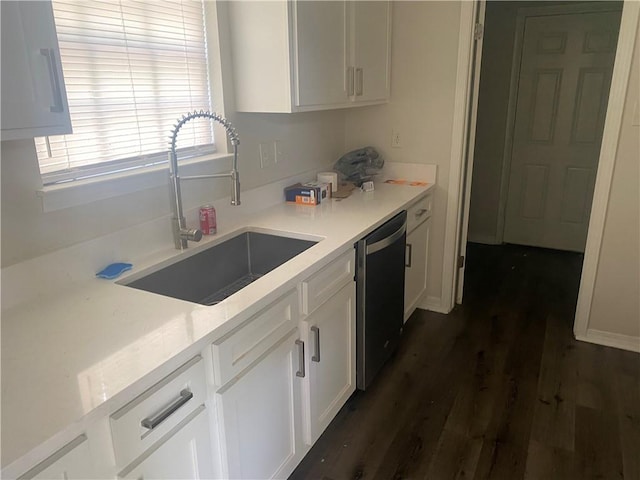 9424 Johnson Rd S, Mobile, AL 36695 - kitchen featuring a sink, dishwasher, white cabinetry, dark wood-style flooring, and light countertops