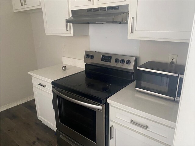9424 Johnson Rd S, Mobile, AL 36695 - kitchen with appliances with stainless steel finishes, under cabinet range hood, white cabinetry, and light countertops
