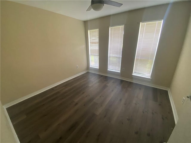 9424 Johnson Rd S, Mobile, AL 36695 - spare room featuring dark wood-type flooring, baseboards, and ceiling fan