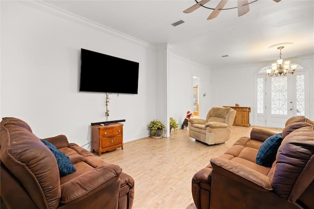 living room with ornamental molding, ceiling fan, and light wood-type flooring