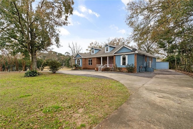 view of front of house with a porch and a front lawn