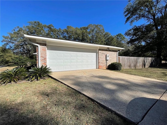 garage featuring a yard