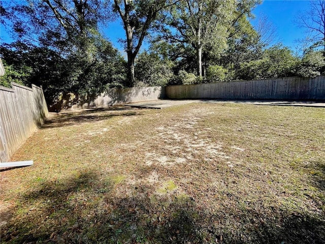 view of yard with a fenced backyard