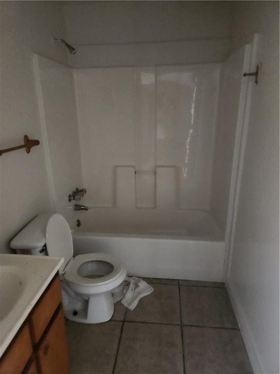 full bathroom with toilet, tile patterned flooring,  shower combination, and vanity