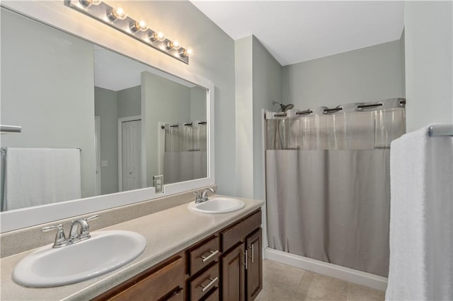 bathroom with vanity, tile patterned floors, and walk in shower