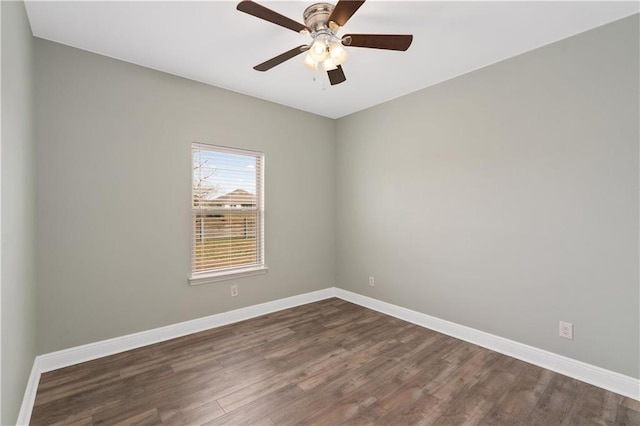 unfurnished room with dark hardwood / wood-style floors and ceiling fan