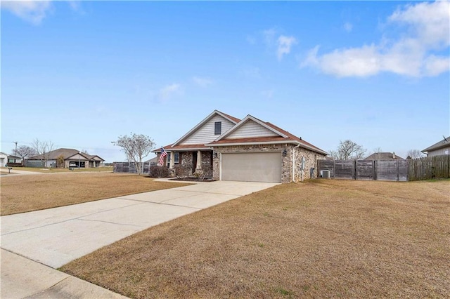 view of front facade with a garage and a front lawn