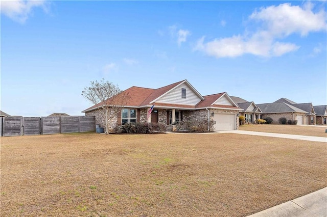 ranch-style house featuring a garage and a front lawn