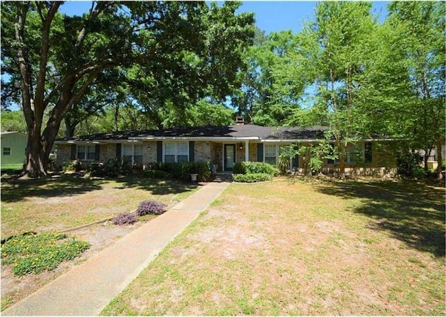 ranch-style home with a front lawn