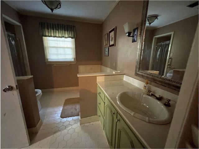 bathroom with crown molding, tile flooring, vanity, and toilet