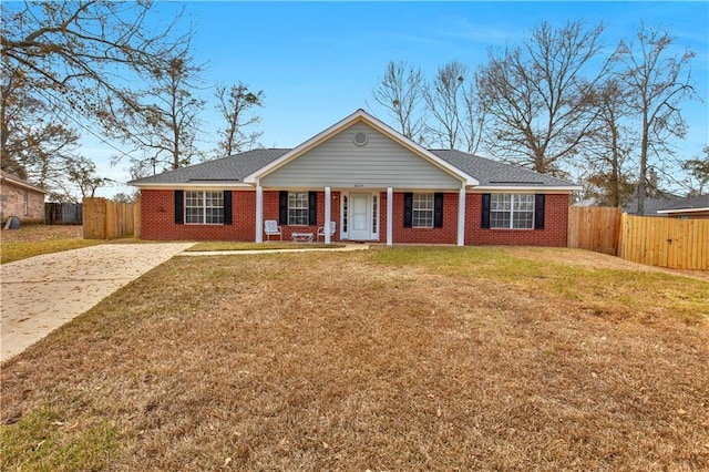 single story home with a front lawn and covered porch