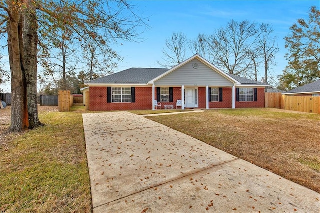 ranch-style house with a porch and a front yard