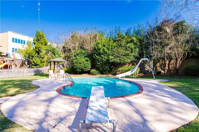343 Bromley Pl, Mobile, AL 36606 - view of swimming pool with a diving board, a water slide, a patio area, and a fenced backyard