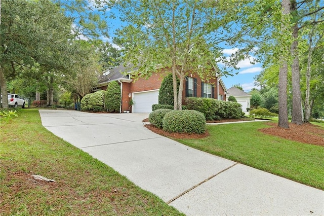 view of front of home featuring a front lawn and a garage