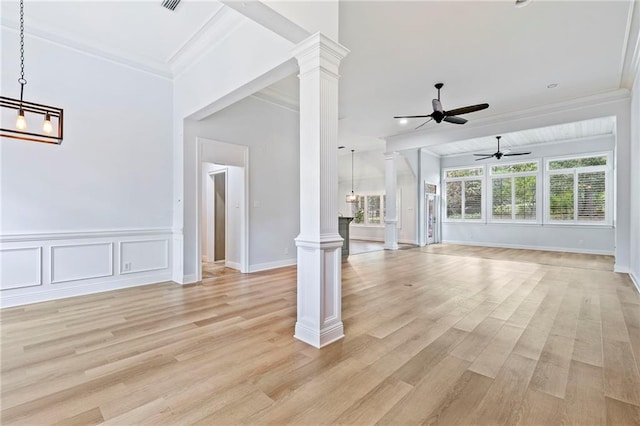 unfurnished living room with ceiling fan, light hardwood / wood-style flooring, crown molding, and ornate columns