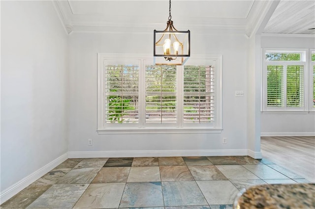 unfurnished dining area featuring a notable chandelier and crown molding