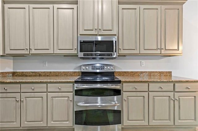 kitchen featuring appliances with stainless steel finishes and stone countertops