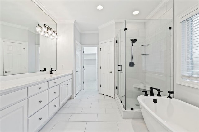 bathroom featuring ornamental molding, vanity, plenty of natural light, and separate shower and tub