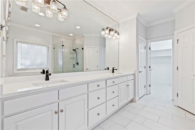 bathroom with ornamental molding, tile patterned floors, walk in shower, and vanity