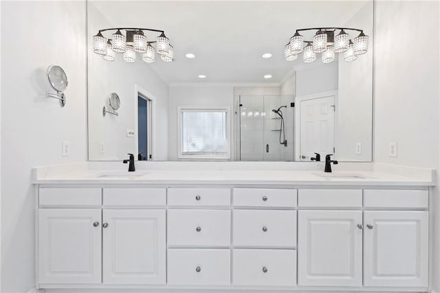 bathroom with walk in shower, vanity, and crown molding