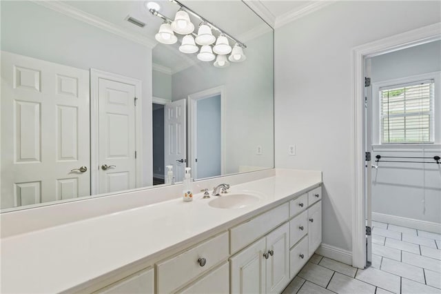 bathroom with ornamental molding, tile patterned flooring, and vanity