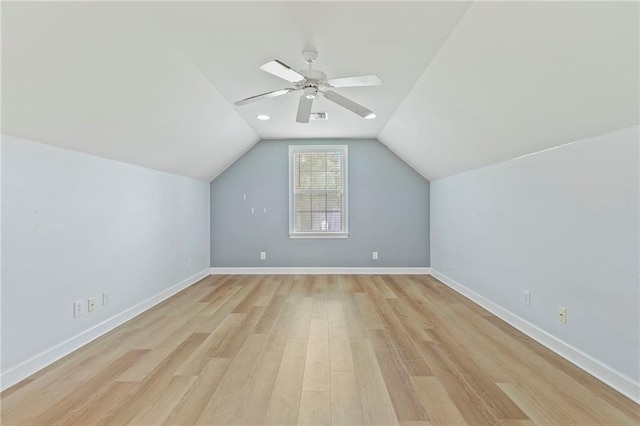 additional living space with light wood-type flooring, vaulted ceiling, and ceiling fan