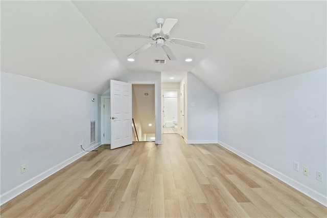 bonus room featuring light hardwood / wood-style flooring, vaulted ceiling, and ceiling fan