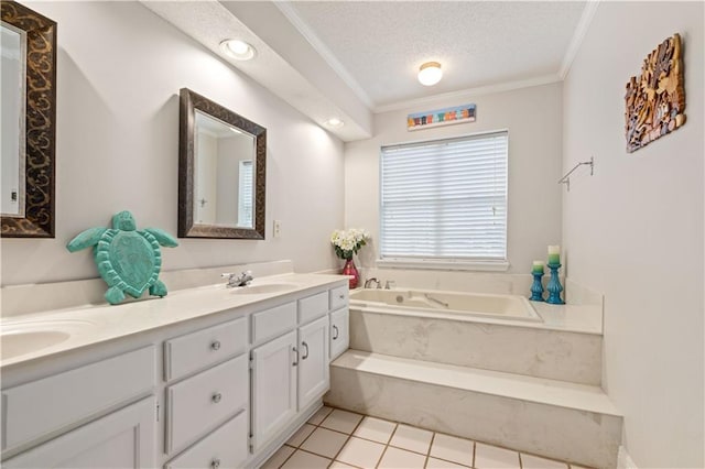 bathroom with tile patterned floors, ornamental molding, vanity, a textured ceiling, and a bathing tub