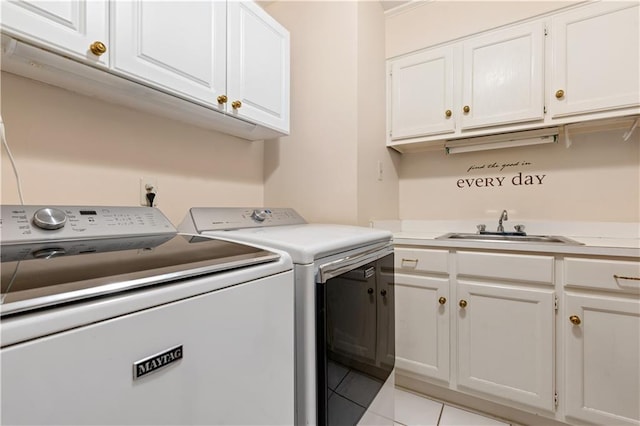 washroom featuring cabinets, independent washer and dryer, sink, and light tile patterned floors