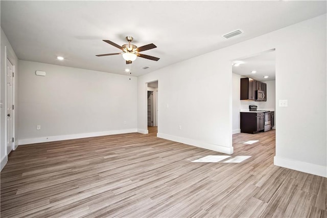 unfurnished room featuring recessed lighting, visible vents, baseboards, a ceiling fan, and light wood-style floors